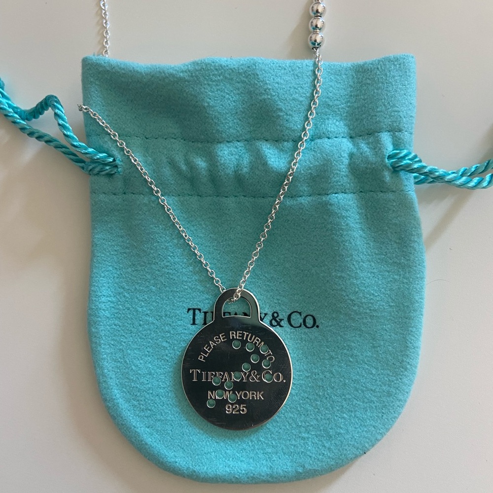 Tiffany & Co sterling silver Sagittarius disc necklace. 28 - 30” length.